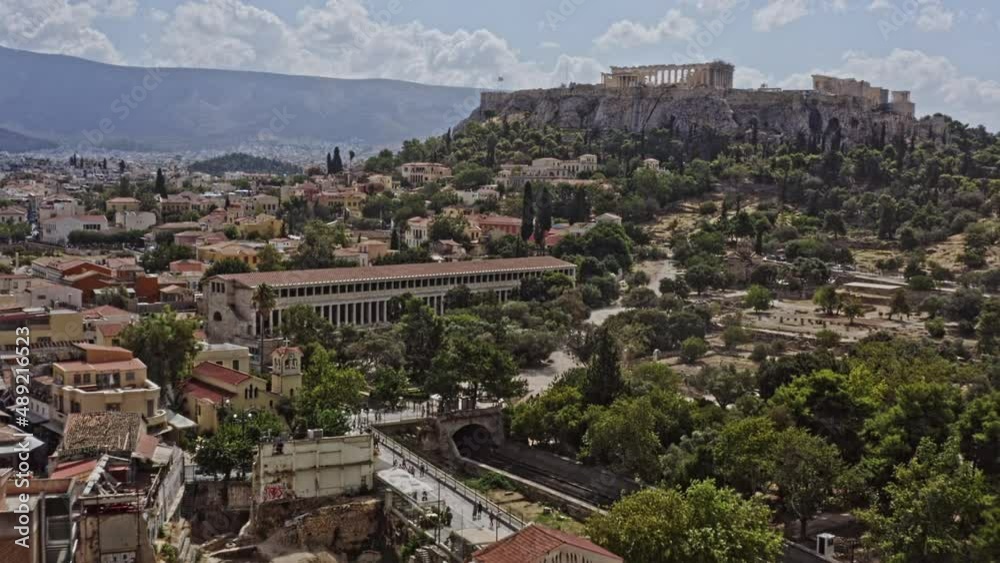 Athens Greece Aerial v15 low level drone flyover monastiraki and plaka neighborhood towards acropolis capturing ancient archaeological sites and downtown cityscape - September 2021 Athens Greece Aerial v15 low level drone flyover monastiraki and plaka neighborhood towards acropolis capturing ancient archaeological sites and downtown cityscape - September 2021