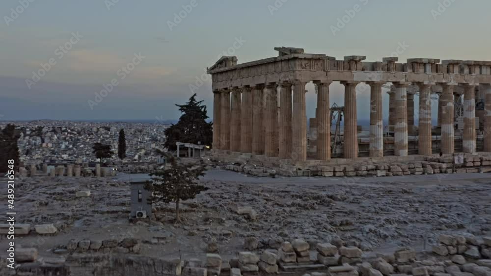 Athens Greece Aerial v32 low level fly around close up shot of ancient ruins of greek parthenon located in city of athens with majestic golden sunset and cityscape in the background - September 2021
