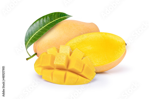 Quadro su tela Closeup yellow ripe mango with green leaf and cut in half sliced isolated on white background