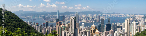 Canvas Print Panorama view of a Hongkong cityscape with skyscrapers against a cloudy sky