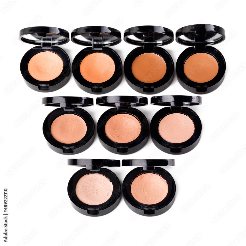 Pots of powder. Studio shot of foundation lying on a isolated background. Pots of powder. Studio shot of foundation lying on a isolated background.