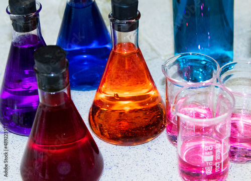 colorful liquids in chemical flasks photo