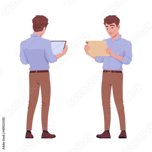 Young handsome businessman standing with tablet. Office boy, student, male manager in formal wear. Vector flat style cartoon character isolated, white background, front, rear