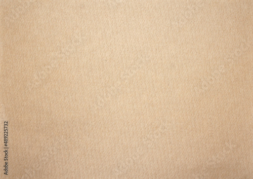 Kraft paper or cardboard background. Brown Paper texture. Empty mock-up. Close-up.