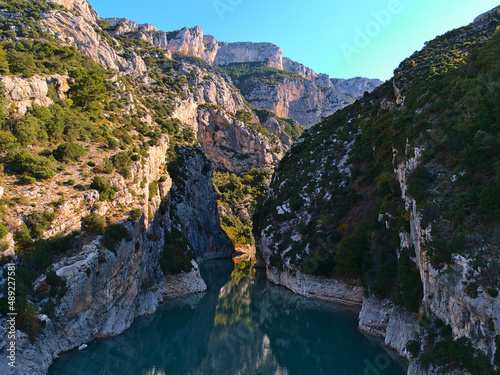 Beautiful view of the western narrow entrance of majestic canyon Verdon Gorge (Gorges du Verdon) in Provence region, France with rugged limestone rock.