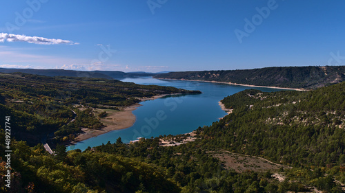 Beautiful panoramic view of reservoir Lake of Sainte-Croix located west of Verdon Gorge in Provence region, France with bridge Pont du Galetas.