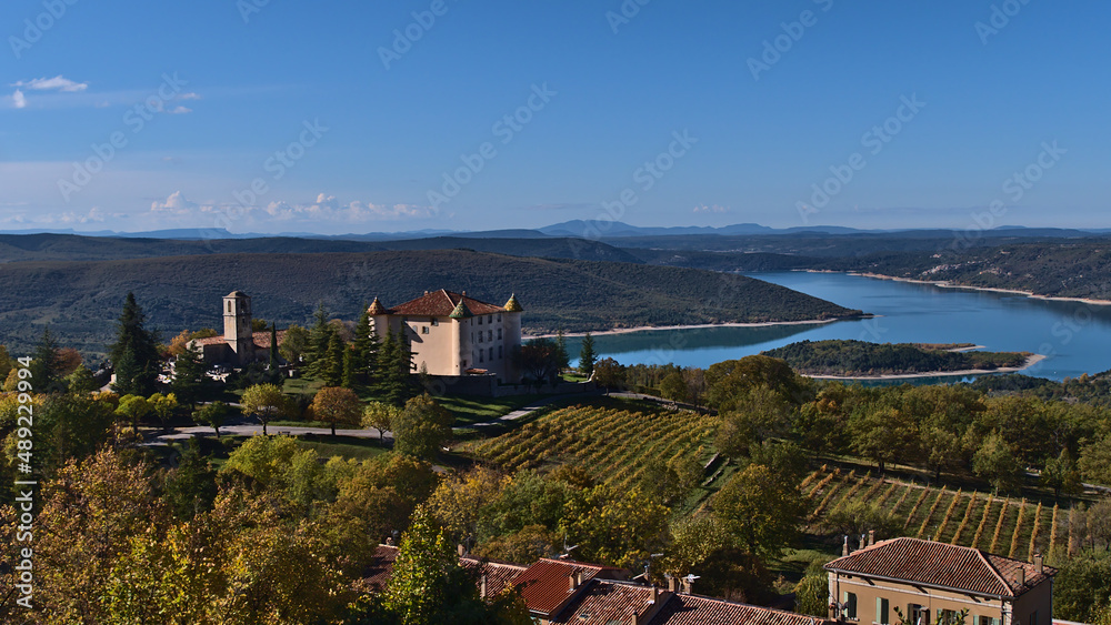 Beautiful view of small village Aiguines, located on the western edge of Verdon Gorge in Provence, France, on sunny day in autumn with vineyards.
