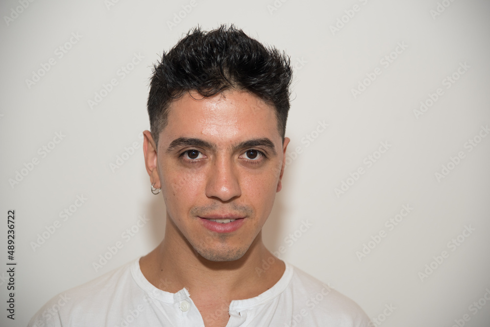 nice guy, dark-haired, white test, white t-shirt, looking straight ahead, neutral background nice guy, dark-haired, white test, white t-shirt, looking straight ahead, neutral background