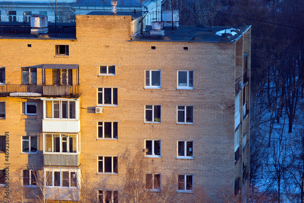 Fototapeta premium Old multi-storey residential building, sunset 