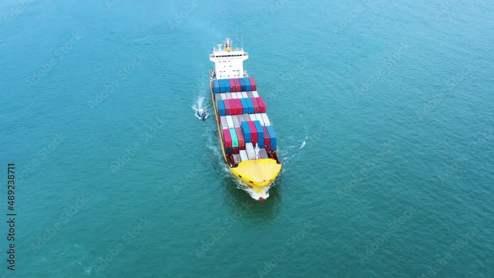 Aerial top view of cargo ship carrying container for import export goods send to customer from cargo yard port ,concept logistic and supply chain Aerial top view of cargo ship carrying container for import export goods send to customer from cargo yard port ,concept logistic and supply chain