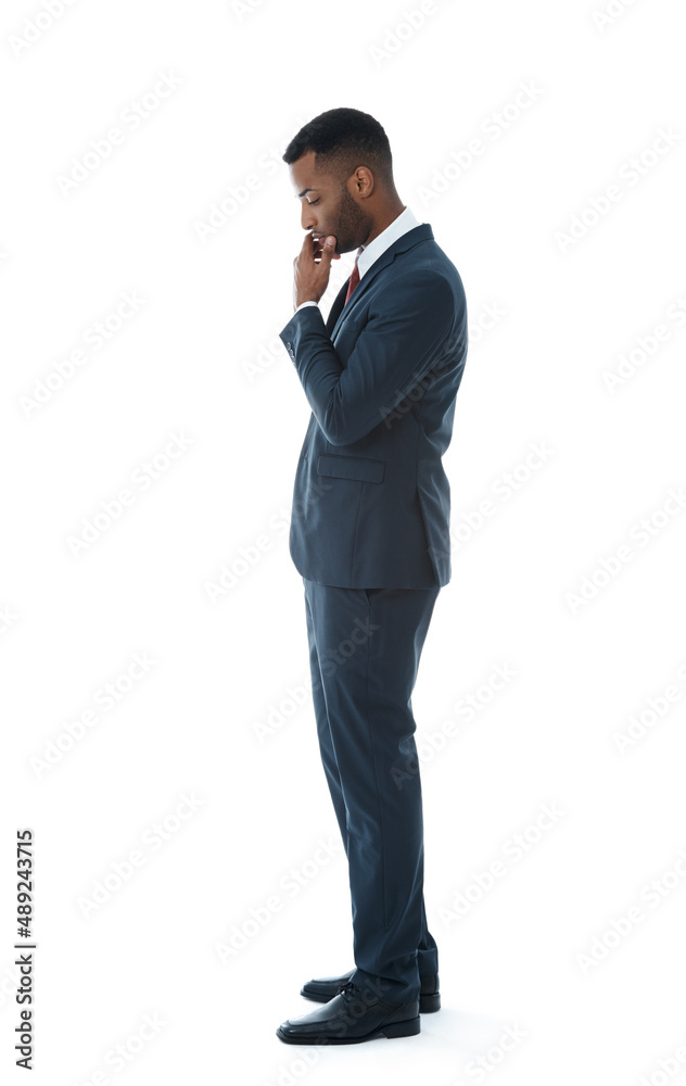 Worried about his job. A serious young businessman looking down while thinking - Isolated on white. Worried about his job. A serious young businessman looking down while thinking - Isolated on white.