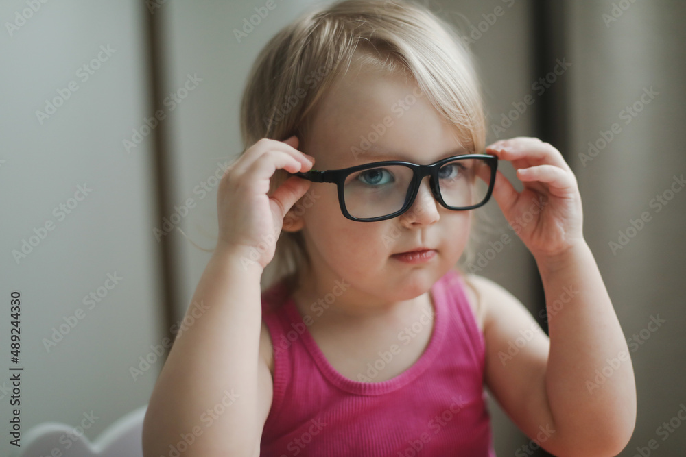 portrait of a little funny girl in eyeglasses. portrait of a little funny girl in eyeglasses.