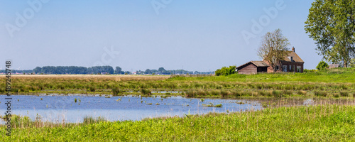 Panoramc view with old house of island and nature reserve Tiengemeten Hoeksche Waard n South Holland in The neteherlands photo
