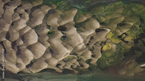 Aerial view of small fishing boats fishing along the Kaliganga river in Dhaka, Bangladesh. photo