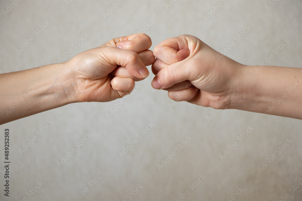 two fists on an isolated background, strength and power, fight and war, stop war two fists on an isolated background, strength and power, fight and war, stop war
