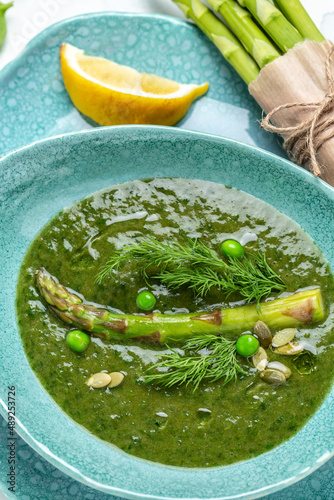 Homemade green asparagus cream soup. Clean eating, dieting, vegan, vegetarian, healthy food concept