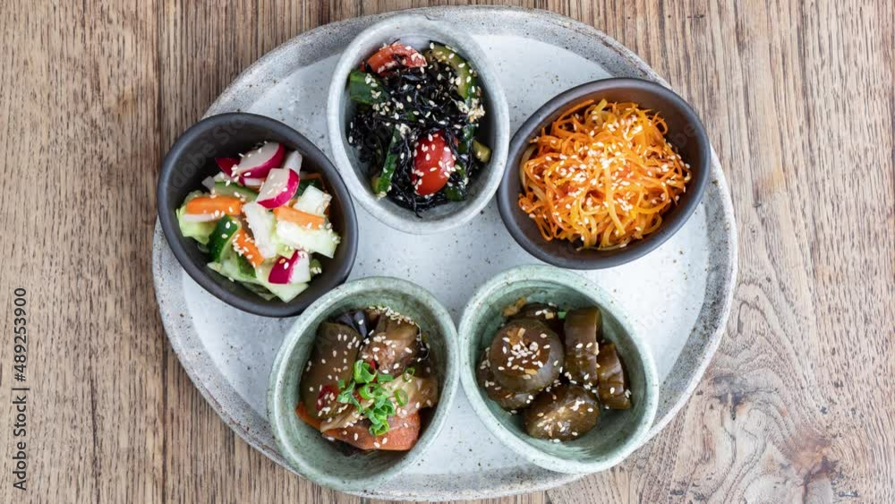 A variety of Japanese vegetable salads, appearing in stop motion. A variety of Japanese vegetable salads, appearing in stop motion.