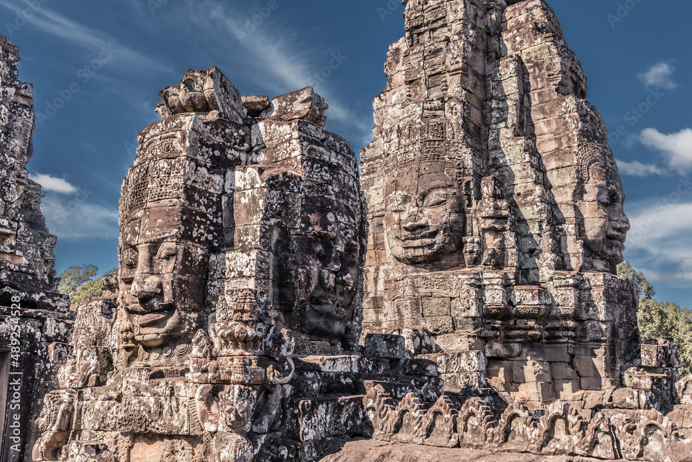 Naklejka premium Sacred faces of ancient kings of Cambodia in Bayon temple of Angkor complex, Siem Reap, Cambodia