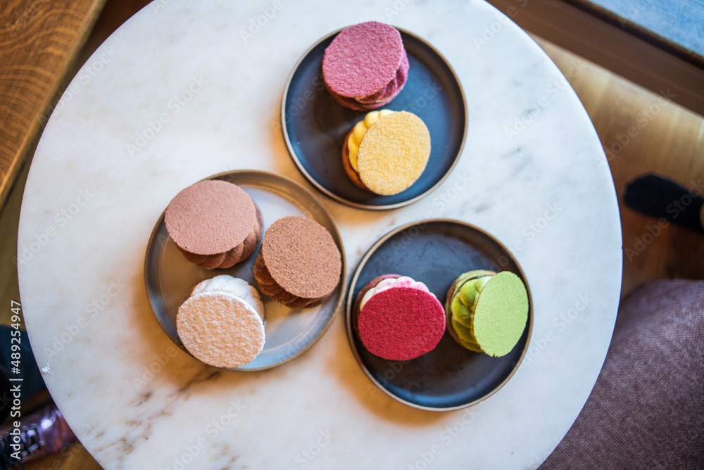 Colourful danish fastelavnsbolle with jam, whipped cream and almond