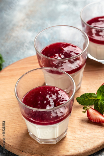 Wallpaper Mural Italian dessert panna cotta with strawberry decorated with fresh berries. homemade dessert panna cotta. vertical image. top view. place for text Torontodigital.ca