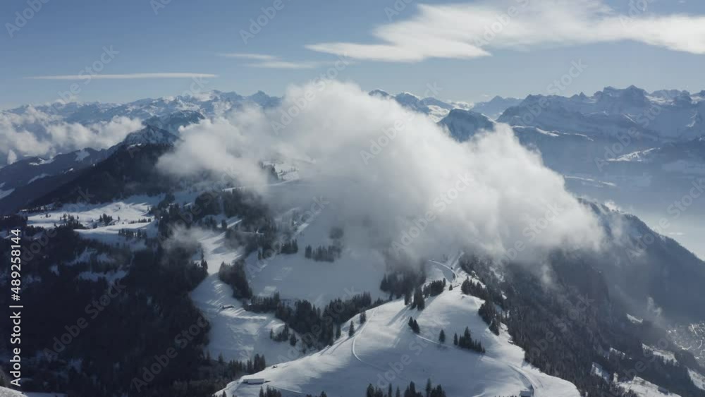 Aerial view of mountain peak covered with snow in wintertime, Lucerne, Switzerland. Aerial view of mountain peak covered with snow in wintertime, Lucerne, Switzerland.