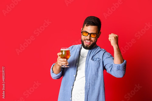 Happy young man in sunglass...