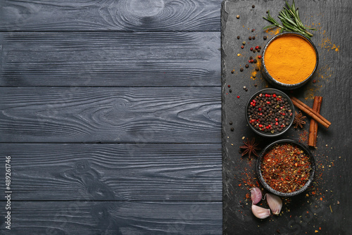 Fototapeta Naklejka Na Ścianę i Meble -  Composition with aromatic spices on dark wooden background
