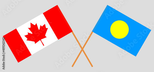 Crossed flags of Canada and Palau. Official colors. Correct proportion