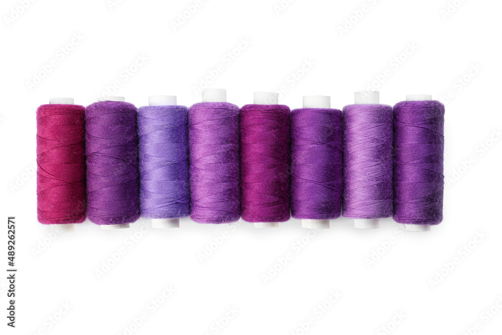 Purple sewing threads on white background Purple sewing threads on white background