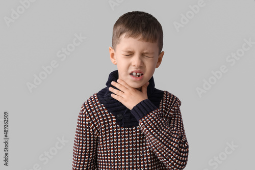 Ill little boy with sore th...