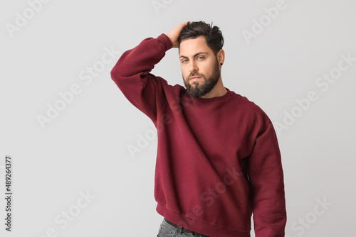 Stylish bearded man on ligh...