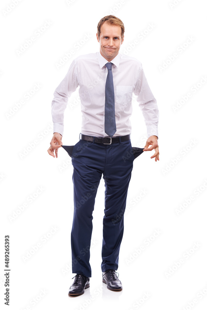 Every business goes through tough times. Portrait of a handsome businessman pulling out his pockets and shrugging. Every business goes through tough times. Portrait of a handsome businessman pulling out his pockets and shrugging.