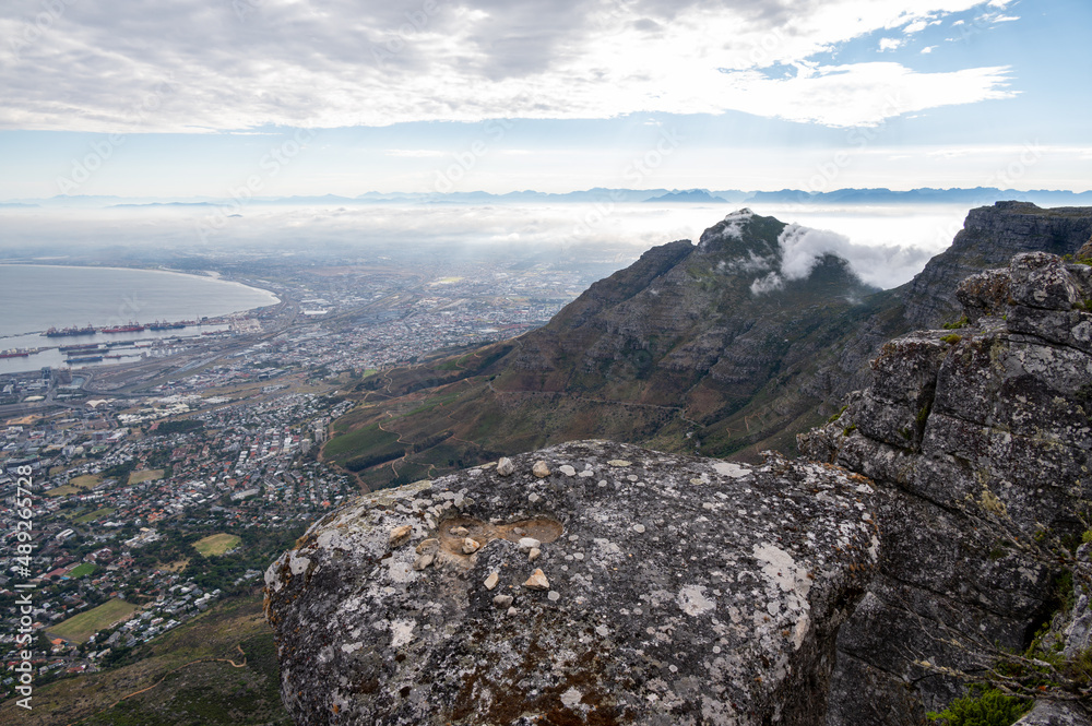View from Table Mountain over Cape Town with a cloudy sky