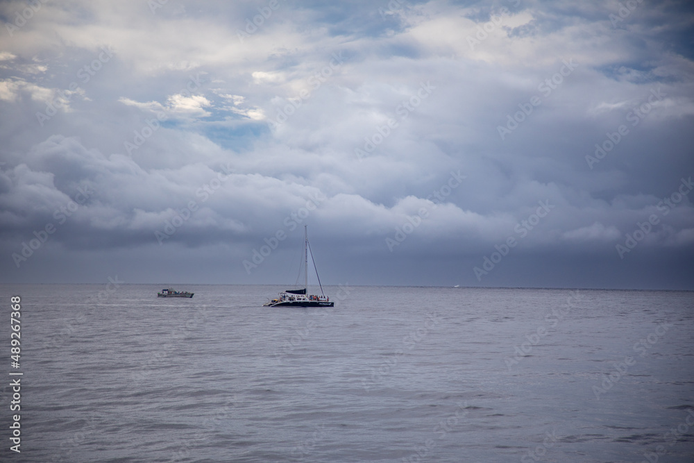Boat on the ocean with stormy clouds
Boat on the ocean with stormy clouds