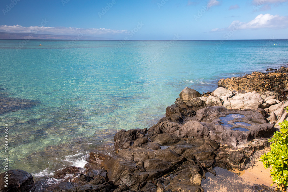 Beach in Maui with ocean and blue sky Beach in Maui with ocean and blue sky