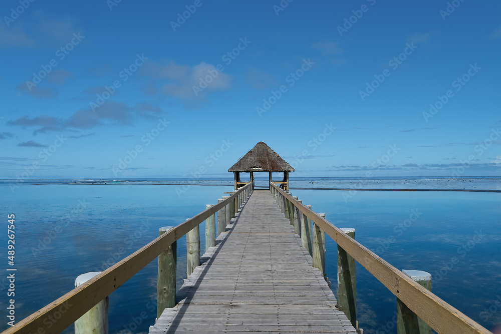 Pier across an ocean bay with gazebo in Fiji