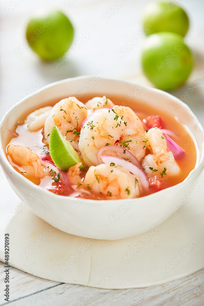 Ecuadorian shrimp ceviche, a traditional appetizer. On a white wooden table. 