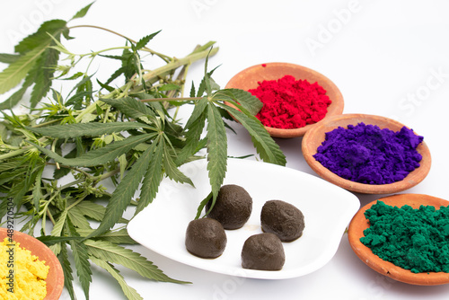 Bhaang Ki Goli Or Bhang Ka Gola Is Made Of Is Herbal Edible Balls Made Of Cannabis Leaves Paste And Is Consumed Specially On Indian Festival Holi For Fun. Color Powder In Terracotta Bowls photo