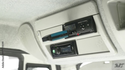 Driver inserts a digital tachograph reader into the tachograph. Tachograph download. Police check. Control