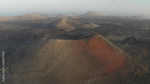 Aerial view of Caldera Riscada and volcanic formation at sunset on Lanzarote island, Canary Islands, Spain. photo