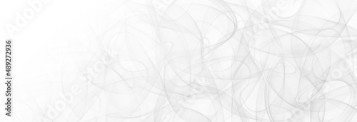 Faint wispy smoke swirls lightly on a white background on this beautiful backdrop wallpaper for website banners.