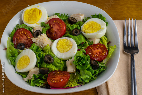 delicious salad with eggs and chicken,
