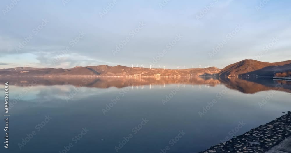 Cinematic look of Danube river nature landscape at sunset. Winter season. Reflection on water. Eastern Serbia. Cinematic look of Danube river nature landscape at sunset. Winter season. Reflection on water. Eastern Serbia.