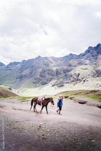 Men with horses on a trail in the Andes Mountains, Peru.  © Rosemary