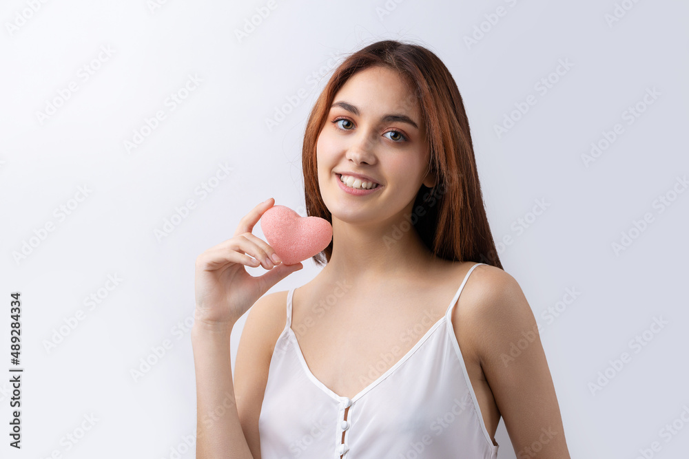 Beautiful smiling woman with clean skin, natural make-up and white teeth on a gray background Beautiful smiling woman with clean skin, natural make-up and white teeth on a gray background