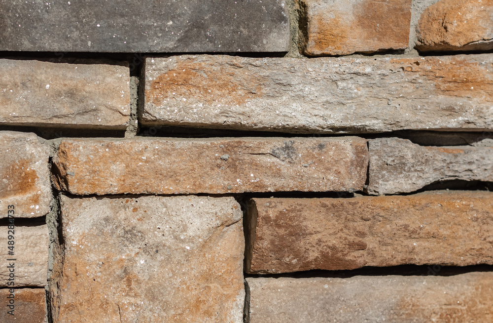 Stone background walls are stacked. Stone cladding background and wallpaper. Stone background walls are stacked. Stone cladding background and wallpaper.