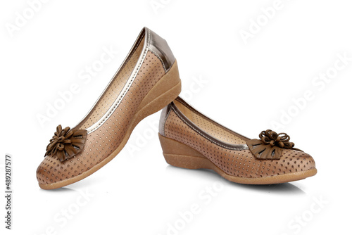 Female brown leather shoe on white background, isolated product.