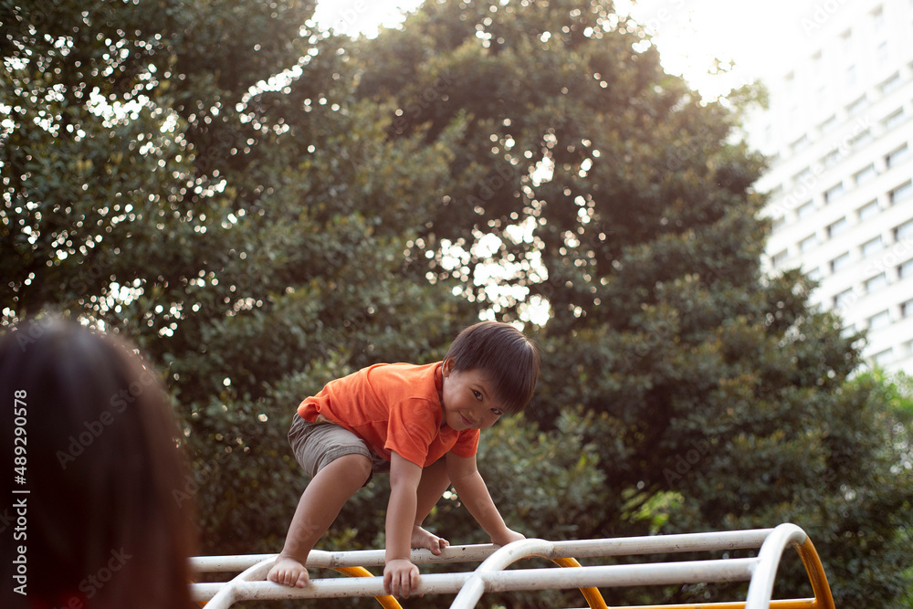 cute happy little boy playing on the playground Stock Photo | Adobe Stock