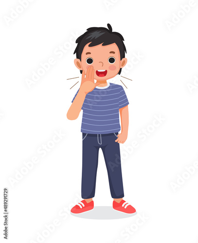cute little child boy shouting and screaming loud with hands near his mouth