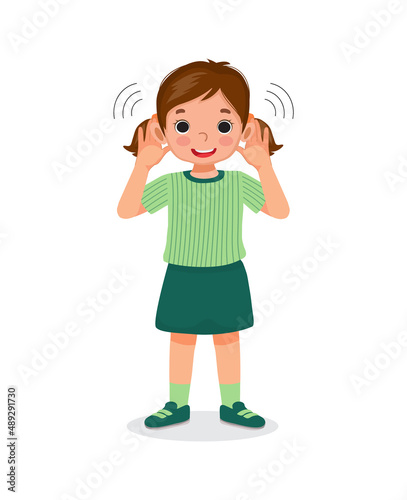cute little girl with hearing problem try listening attentively by putting her hand to both ears